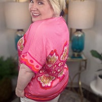 Woman wearing a pink floral top