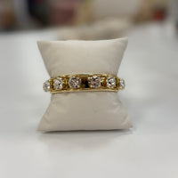 Gold cuff bracelet with clear diamond stones