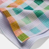 Colorful checkered towel with a diamond pattern on a white background