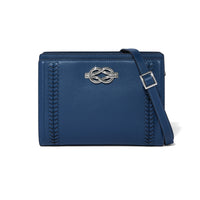Blue leather handbag with a silver logo on a white background