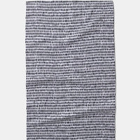 White tea towel with black dot patterns