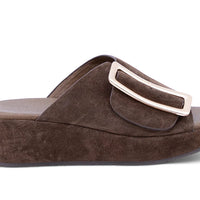 Elara dark brown suede slide sandal with crossover strap and rectangular buckle