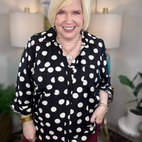 Black button down blouse with white polka dots