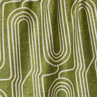 Close-up of green fabric with white geometric pattern