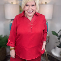 Women’s red matching set with gold button details