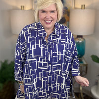 Woman wearing a blue and white geometric patterned shirt