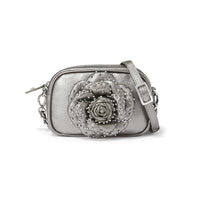 Silver handbag with rose design on a white background