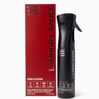 Laundry Sauce packaging with red box and black spray bottle on a white background