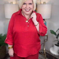 Women’s red matching set with gold button details