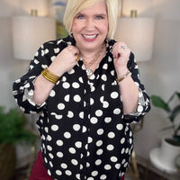 Black button down blouse with white polka dots