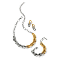 Two-toned silver and gold chain necklace on a white background