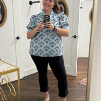 Navy blue pants with a front seam and subtle front slit detail.