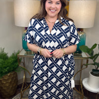 Woman wearing a navy and white patterned dress