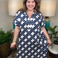 Woman wearing a navy and white patterned dress