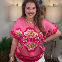 Woman wearing a pink floral top