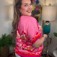 Woman wearing a pink floral top