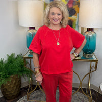 Women's jogger lounge set with raw stitching in red or black