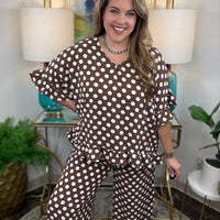 matching brown and white polka dot lounge set, featuring a short-sleeve V-neck top and wide-leg pants with ruffle hems