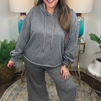 Gray lightweight lounge pants with cream and gold stitching details