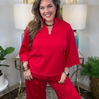 Red two-piece scuba set with scalloped details