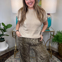 Cream wide-leg pants with brown zebra animal print