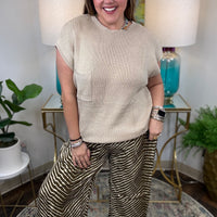 Cream wide-leg pants with brown zebra animal print