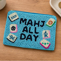 Light blue beaded pouch saying “Mahj All Day” with mahjong tile accents