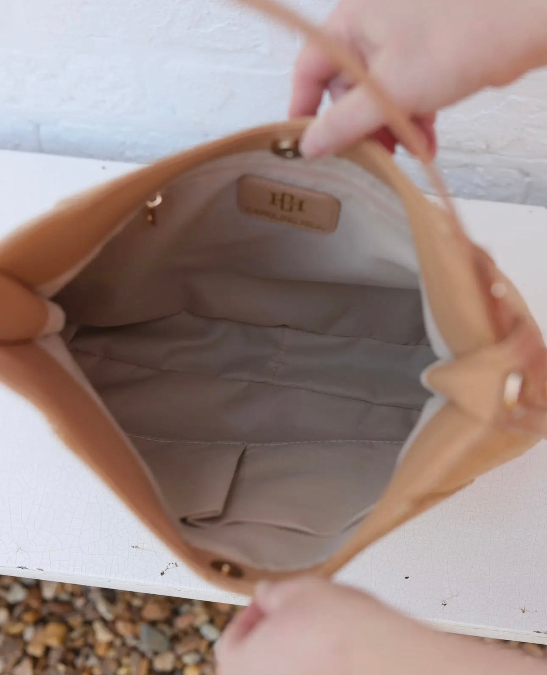Close-up of a beige handbag
