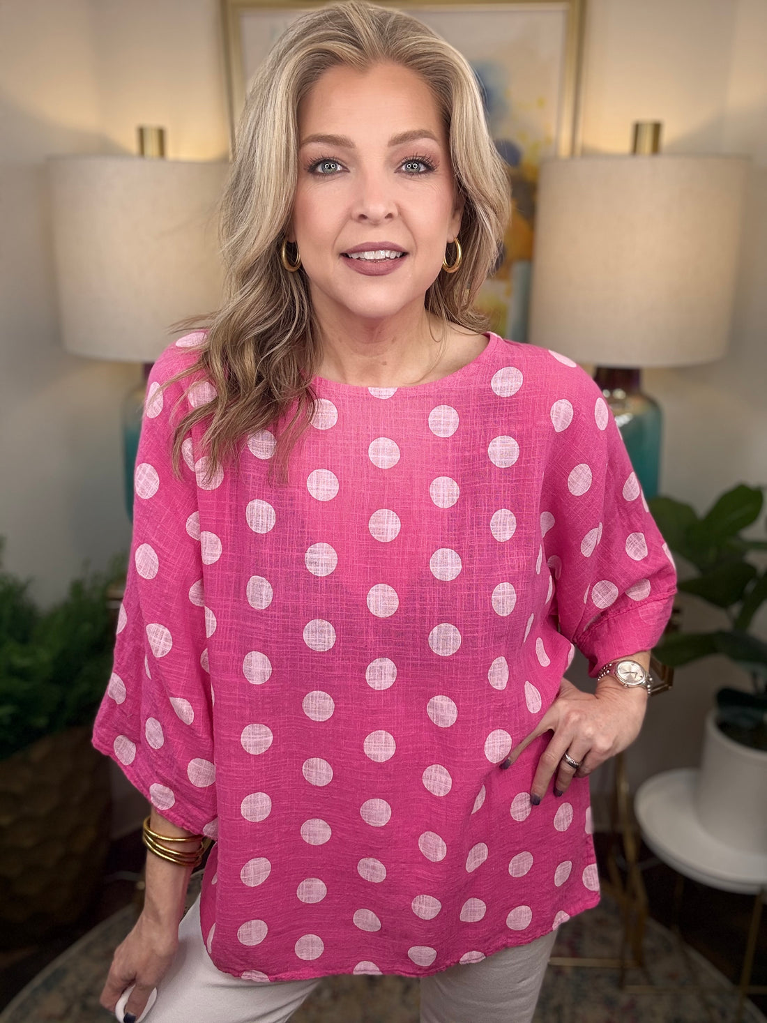 Woman wearing pink polka dot top 