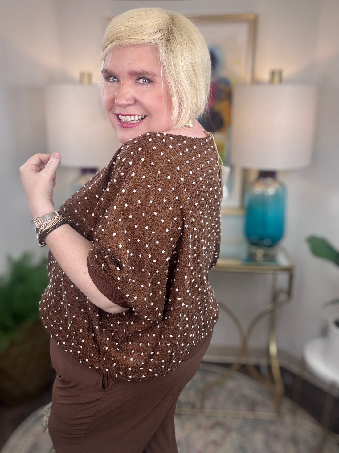 Brown curvy short-sleeve sweater with white polka dot stitching