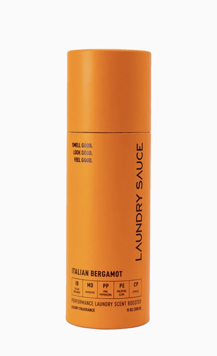 Orange bottle of laundry sauce with &