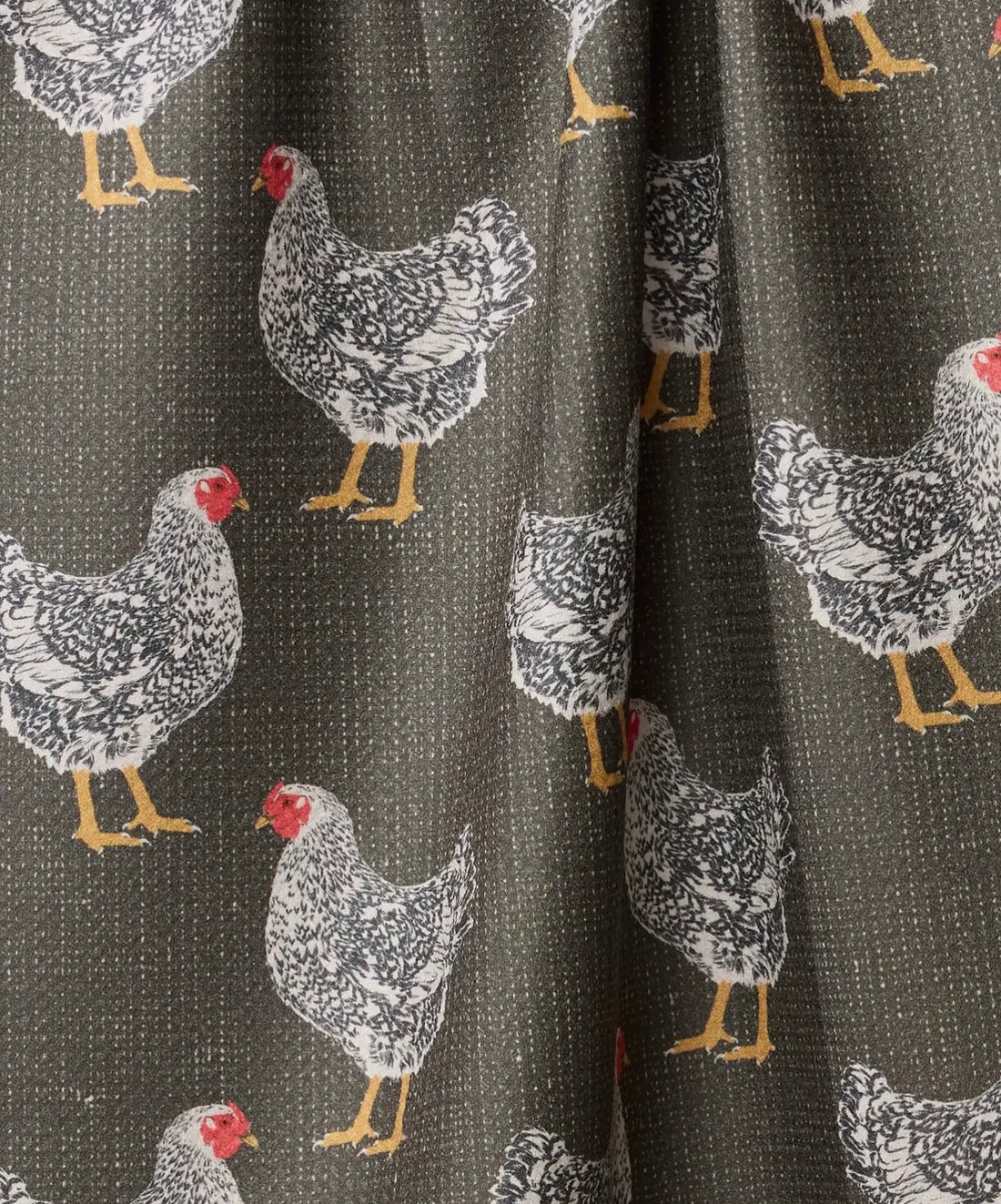 Fabric with chicken pattern on a dark background