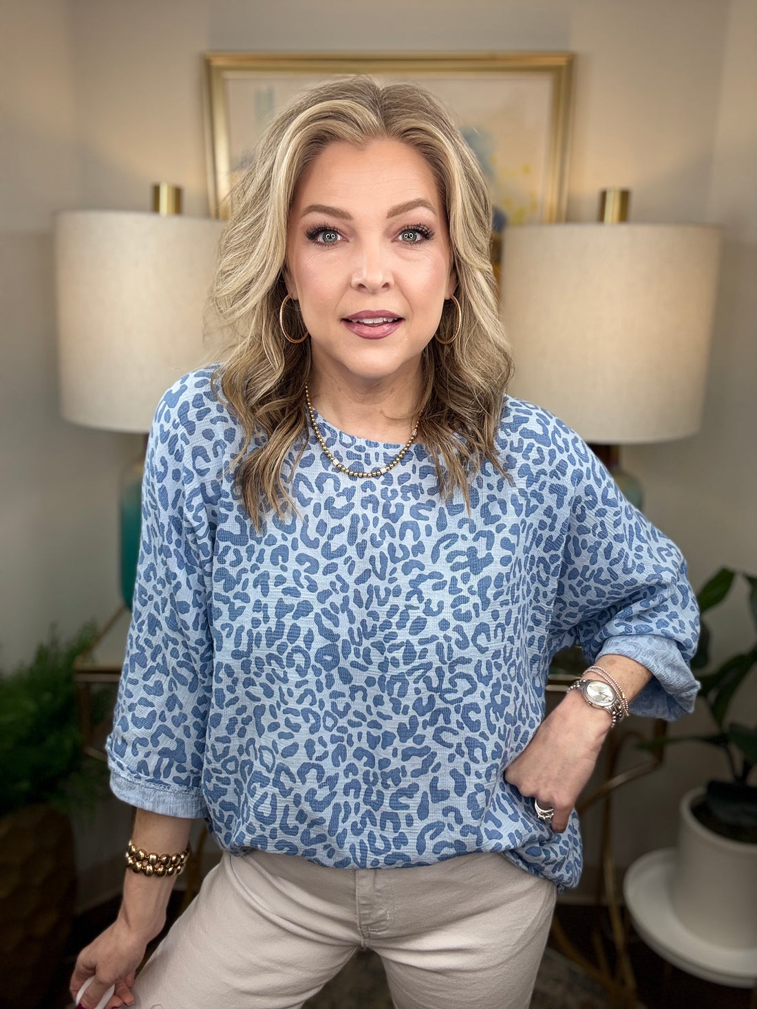 Woman wearing a blue leopard print top