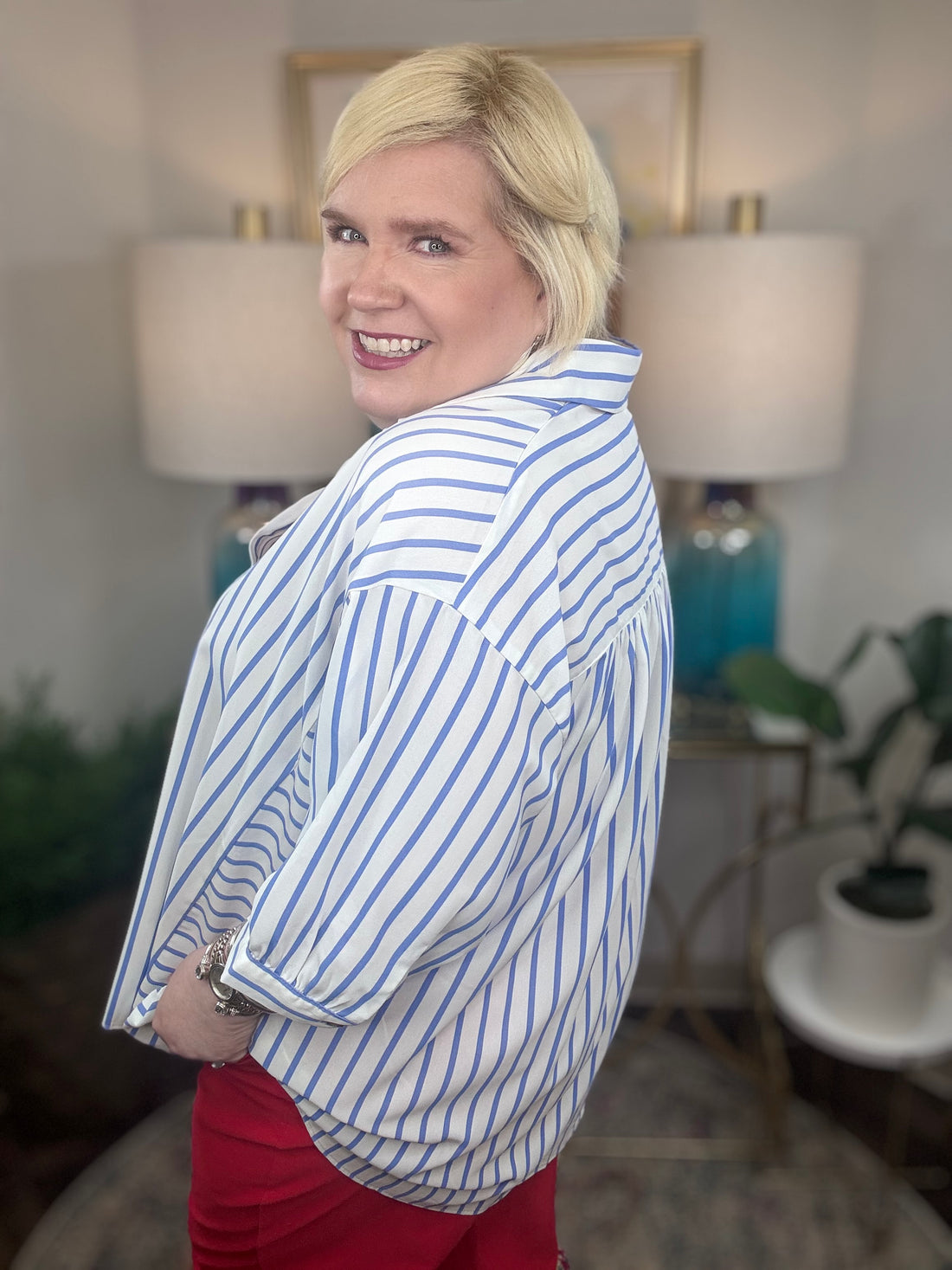 Woman wearing a blue and white striped top