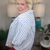 Woman wearing a blue and white striped top