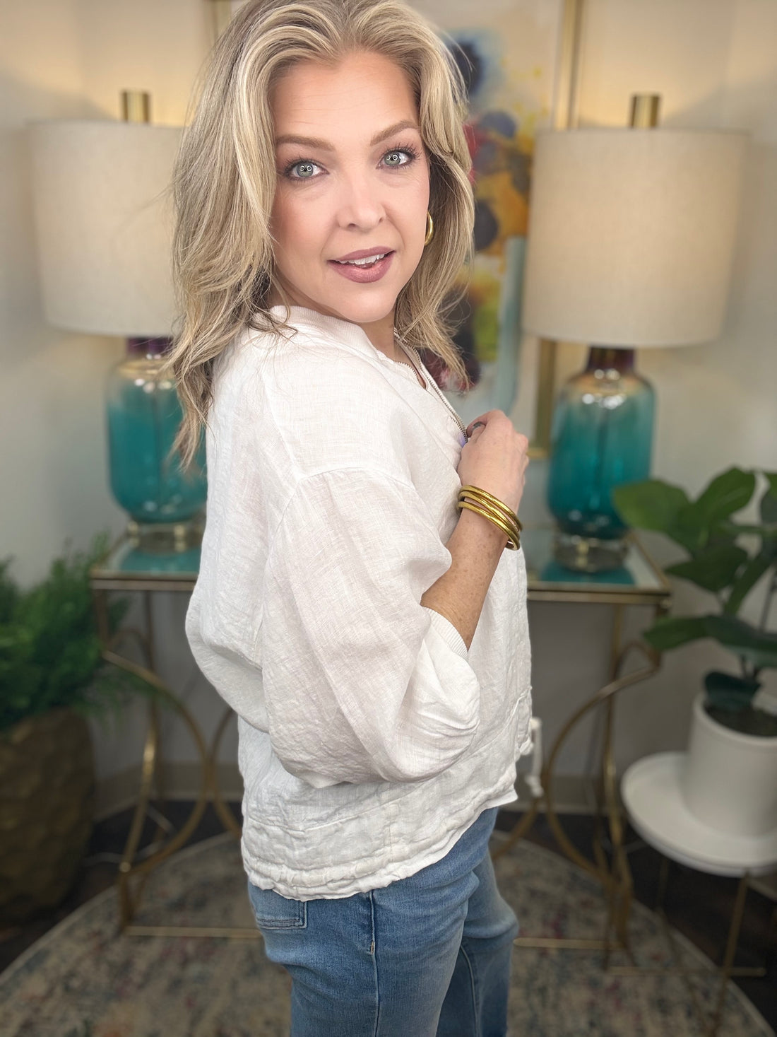 Woman in white linen jacket