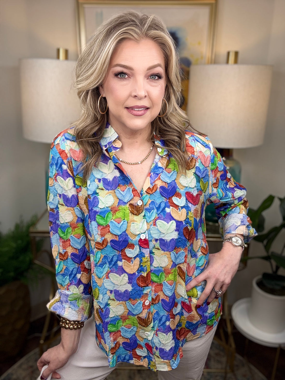 Woman wearing a colorful heart print blouse
