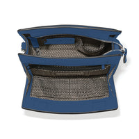 Blue handbag with open front pocket on a white background
