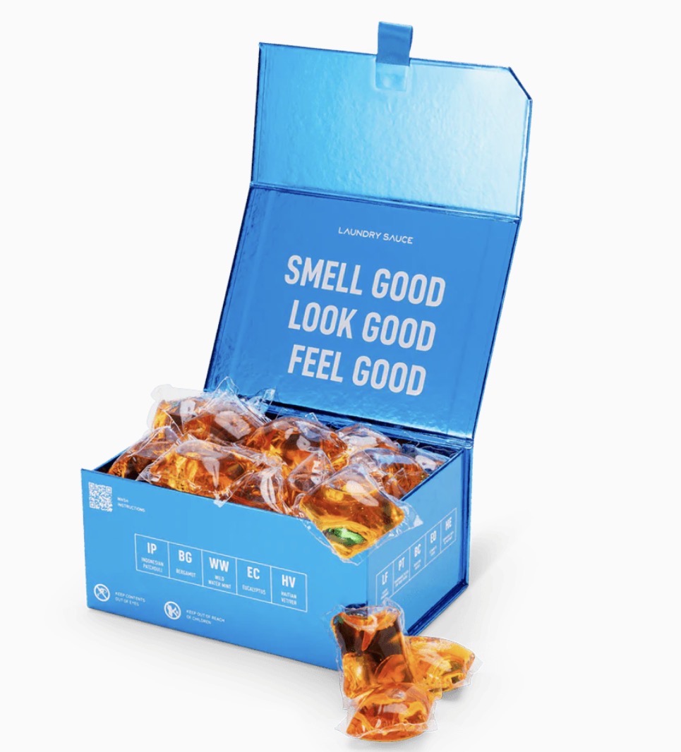 Blue box of laundry detergent pods with text &