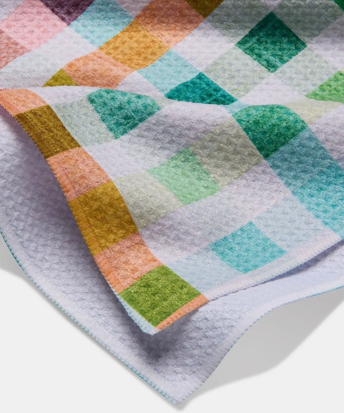 Colorful checkered towel with a diamond pattern on a white background