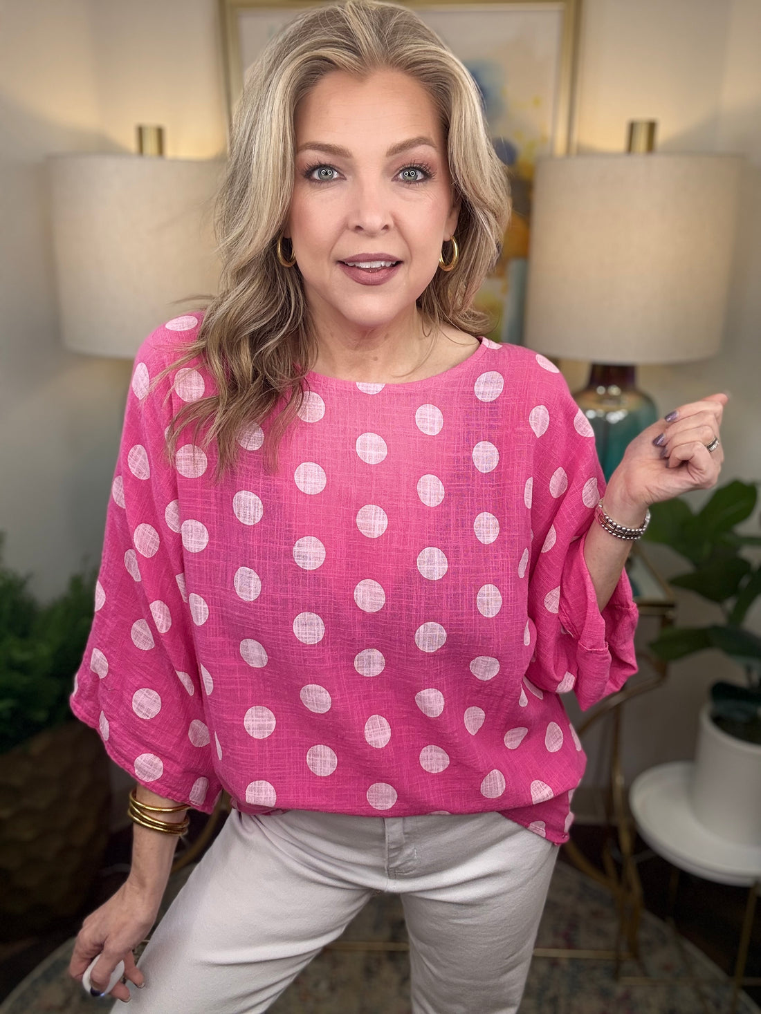 Woman wearing pink polka dot top 