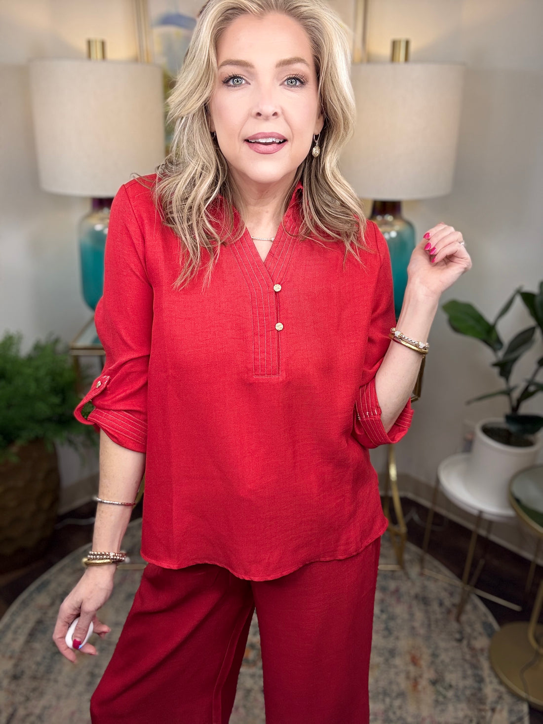 Women’s red matching set with gold button details