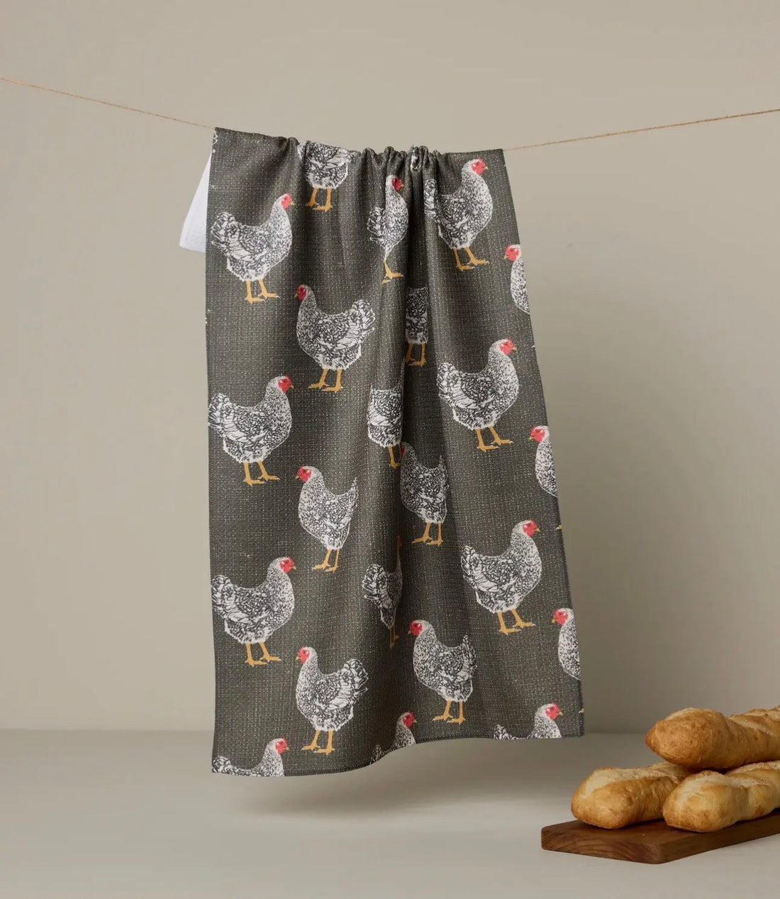 Tea Towel with chicken pattern on a dark gray background