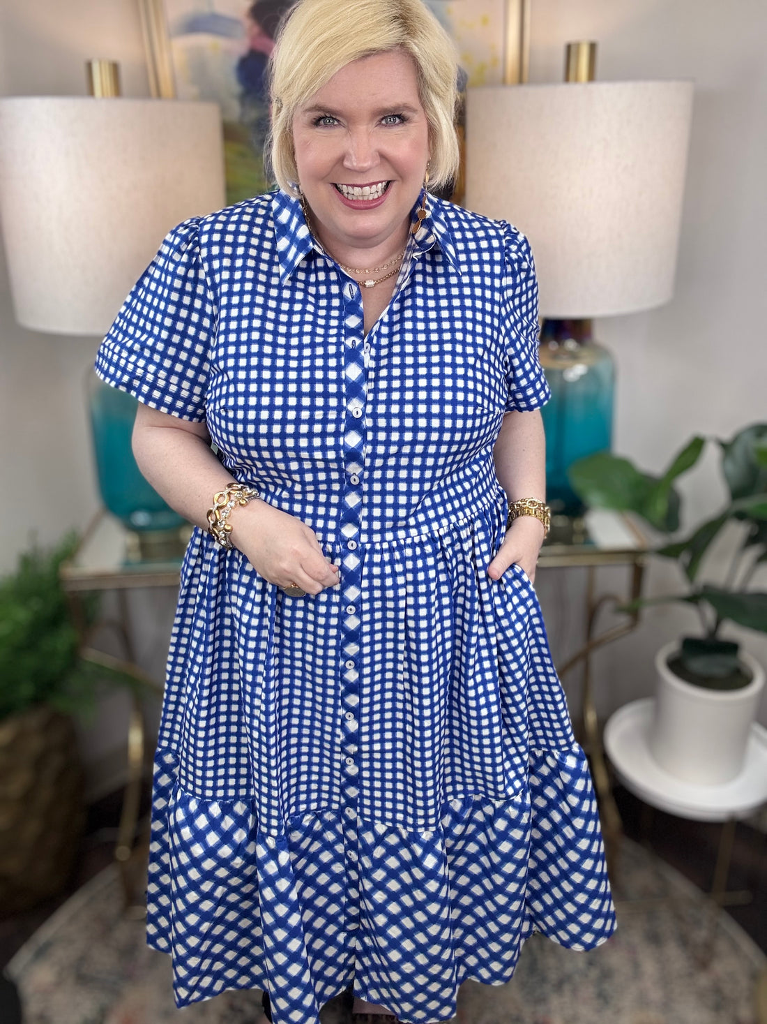 Woman wearing a blue and white checkered maxi dress.