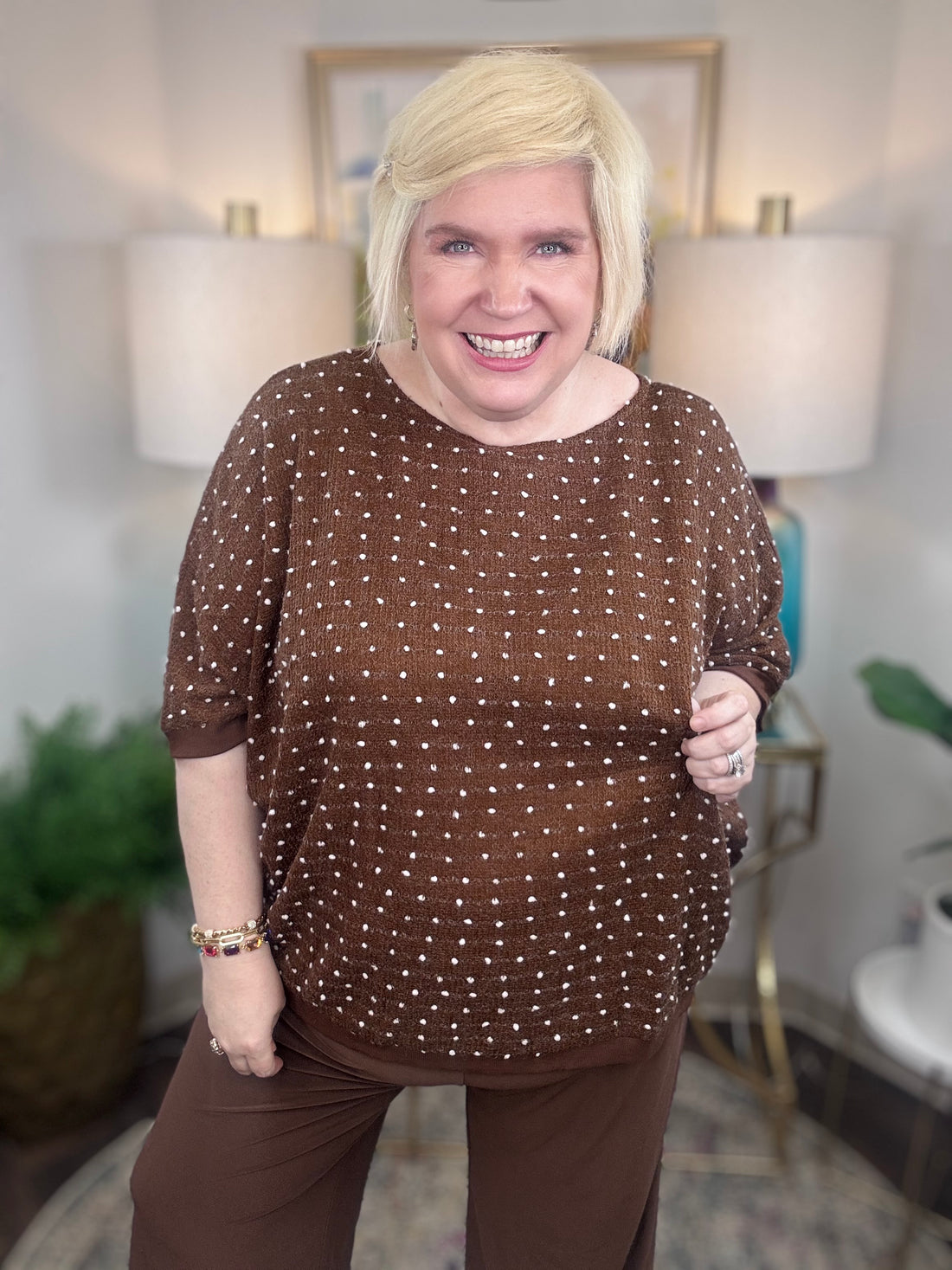 Brown curvy short-sleeve sweater with white polka dot stitching