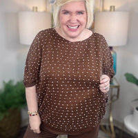 Brown curvy short-sleeve sweater with white polka dot stitching