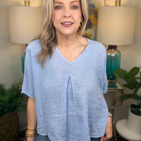 Woman wearing blue linen top