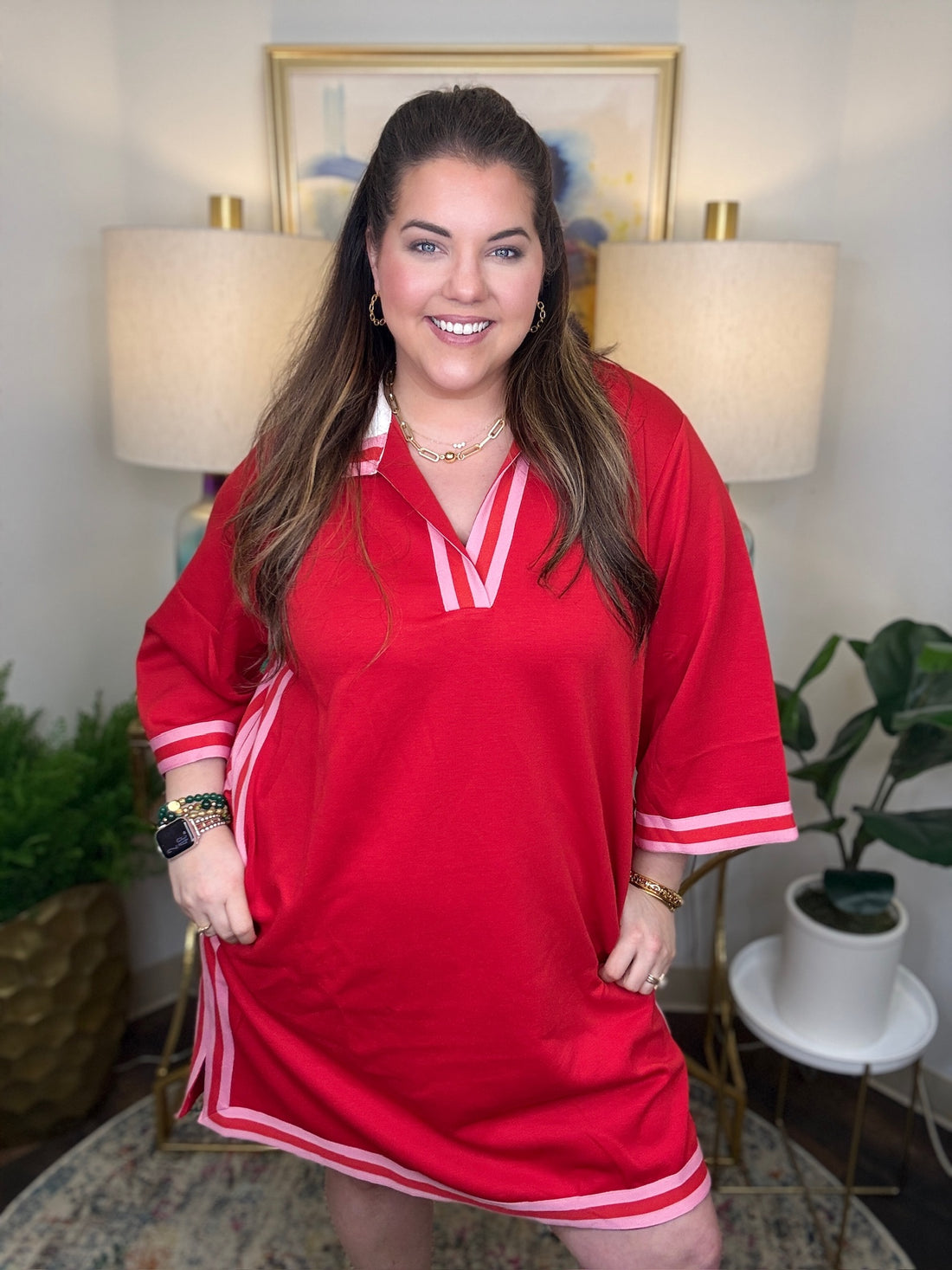 Woman wearing a red and pink dress. 