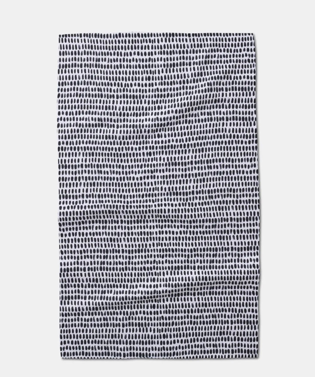 White tea towel with black dot patterns
