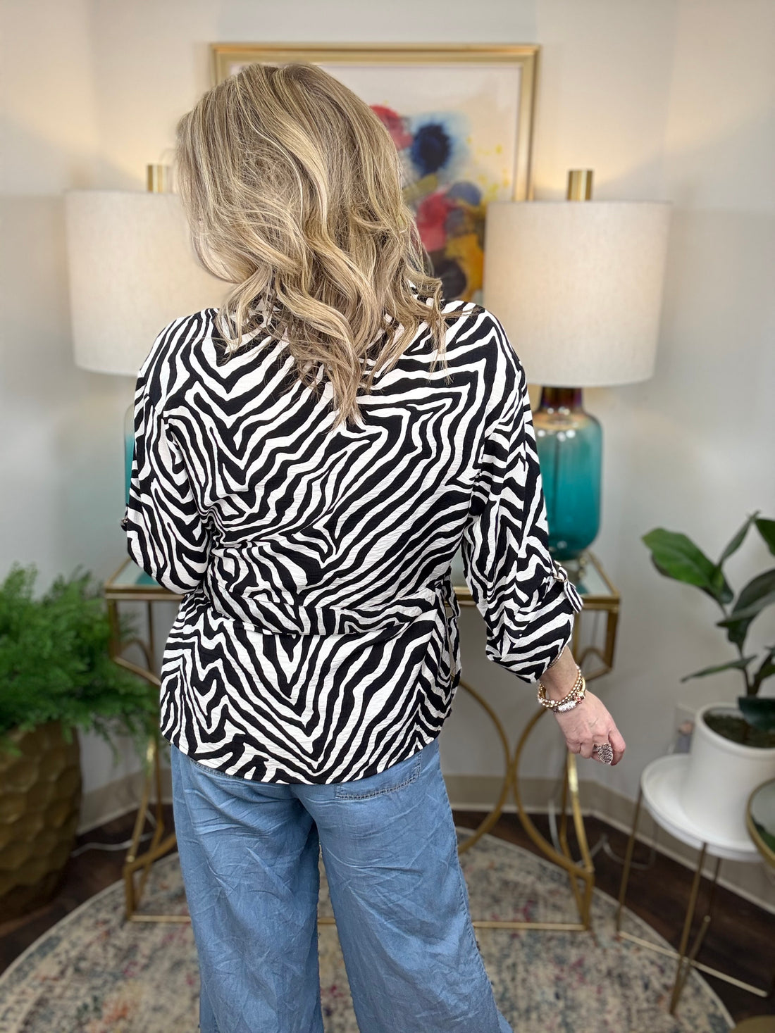 Women’s zebra print blouse with classic button-up design